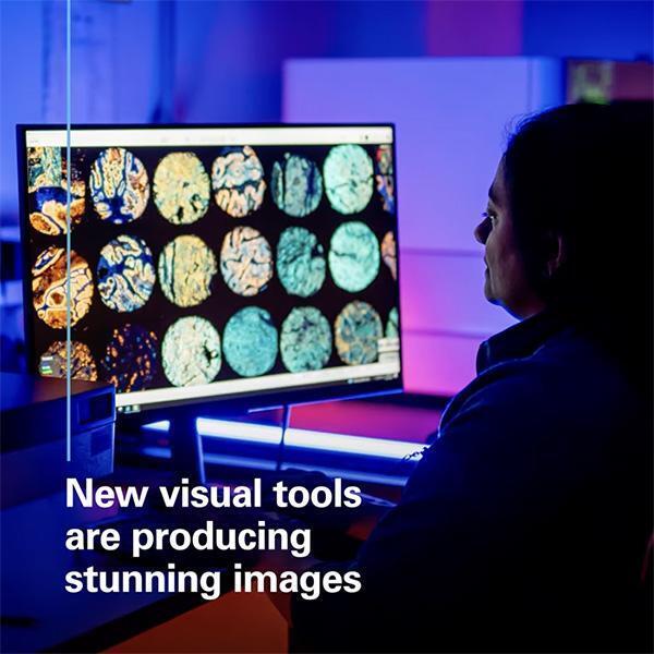 Video still of technician studying medical images on a monitor