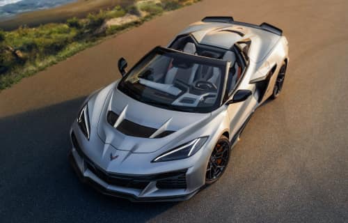 Overhead shot of the Corvette ZR1X Quail Silver Limited Edition parked on a curved road above a shoreline.