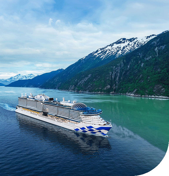 A Pirncess ship sails by a glacier and mountains in Inside Passage, Alaska.