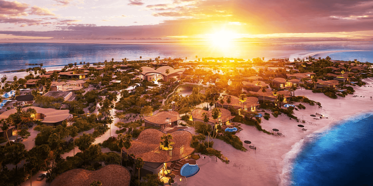 A property surrounded by a beach at sunset.