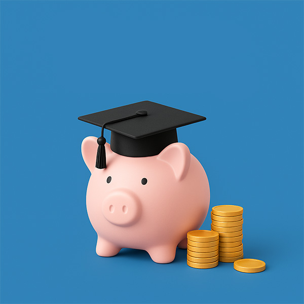 Piggy bank with a graduation hat and coins