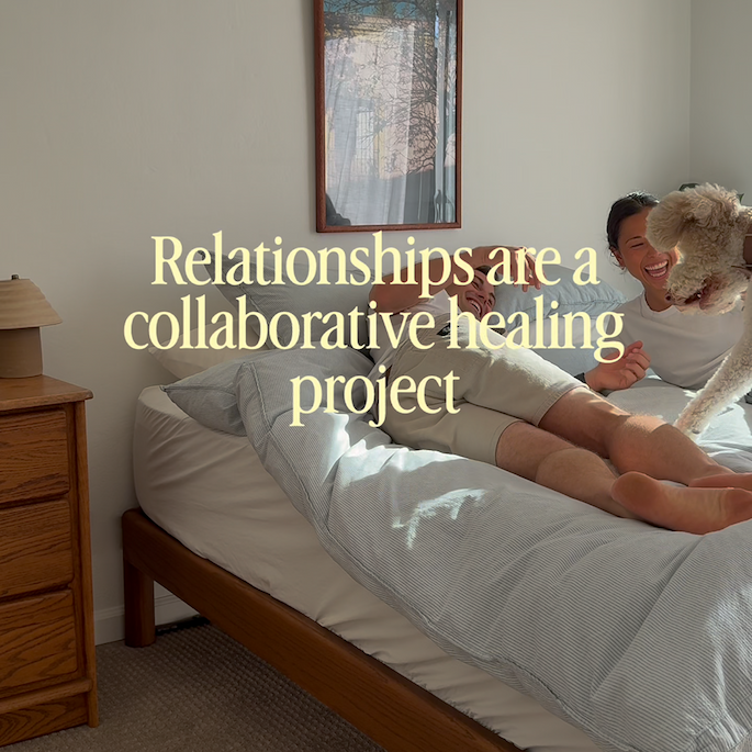 Young couple laughing with dog on Keeps bed frame bolted joinery acorn finish