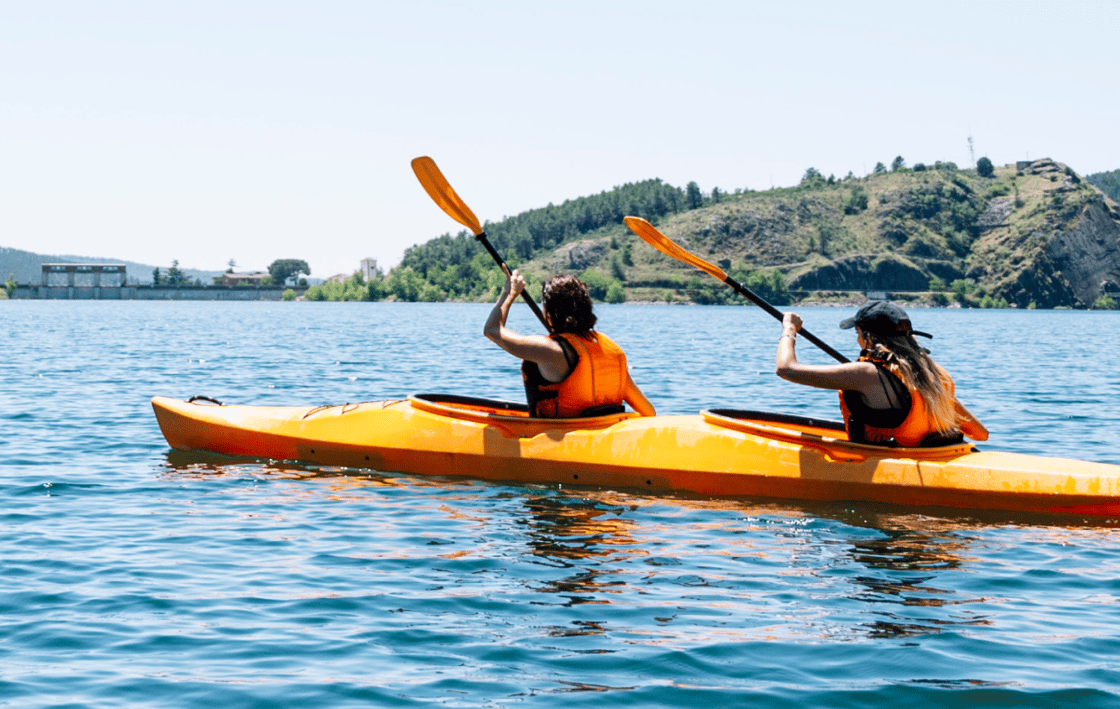 Two people kayaking together. 