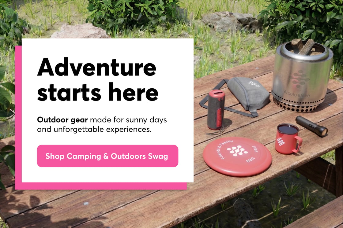 An image of outdoor and camping gear on a wooden table in nature. Next to it, a header that says "Adventure Starts Here" and a button that says "Shop Camping and Outdoors Swag."