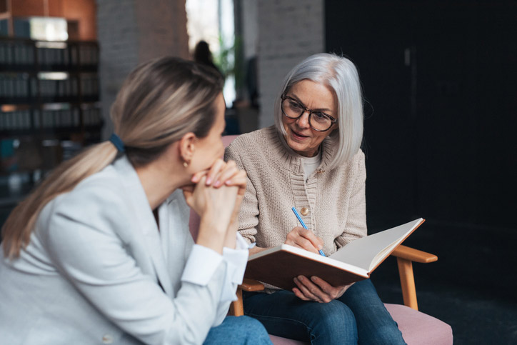 female patient talking 
with her therapist