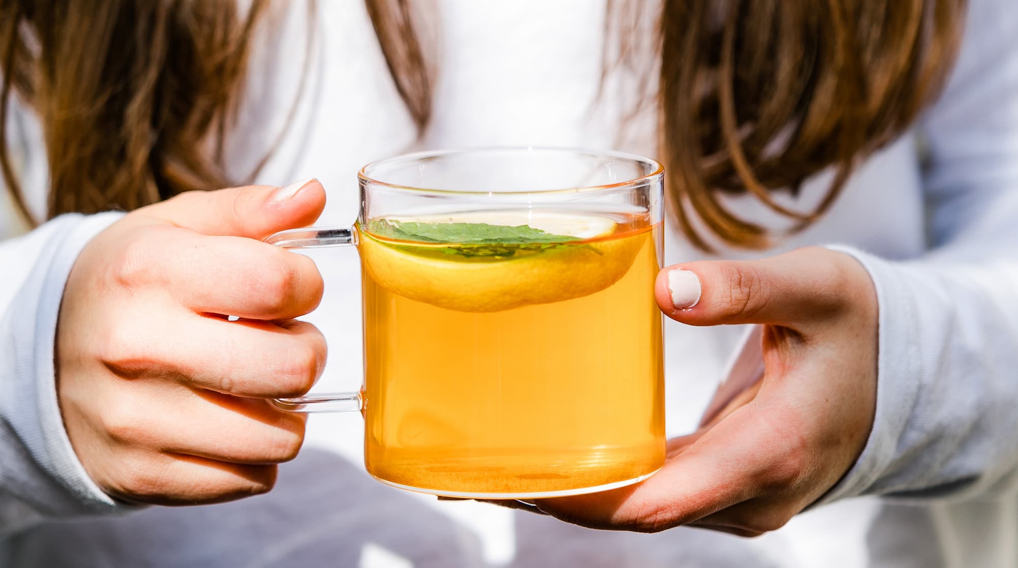 Girl Holding Cup of Tea