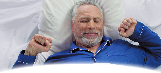 man waking up from a good night's sleep