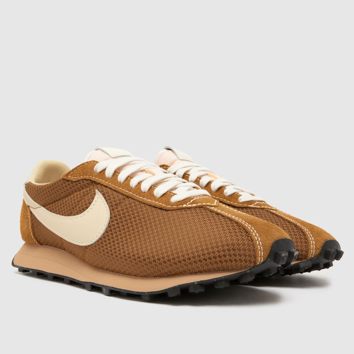 An image of brown Nike trainers