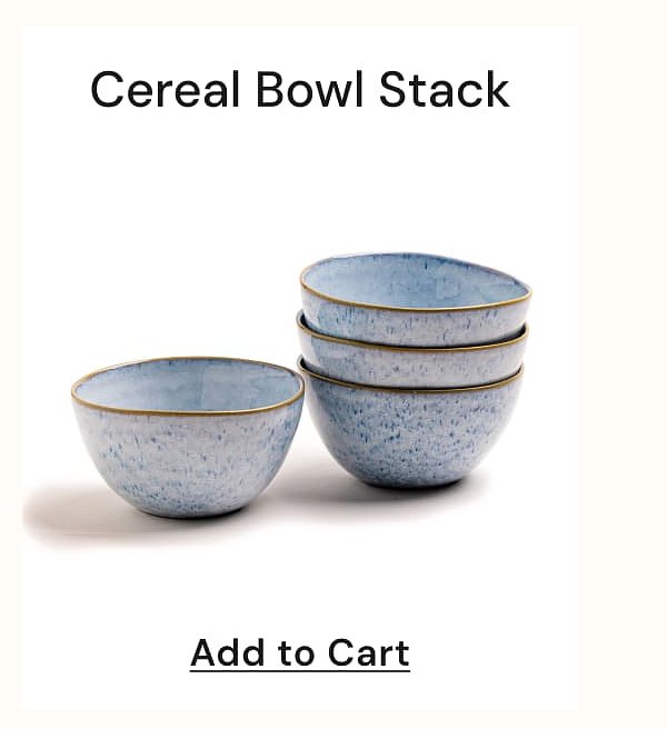 Stack of four blue cereal bowls with a gold rim.