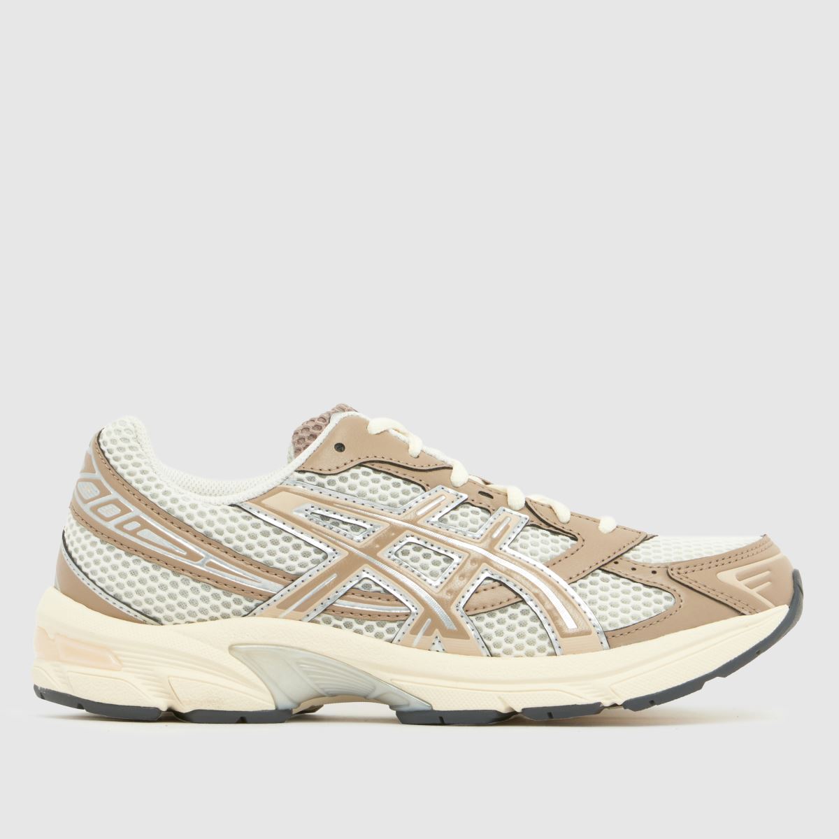 A white and beige ASICS trainer