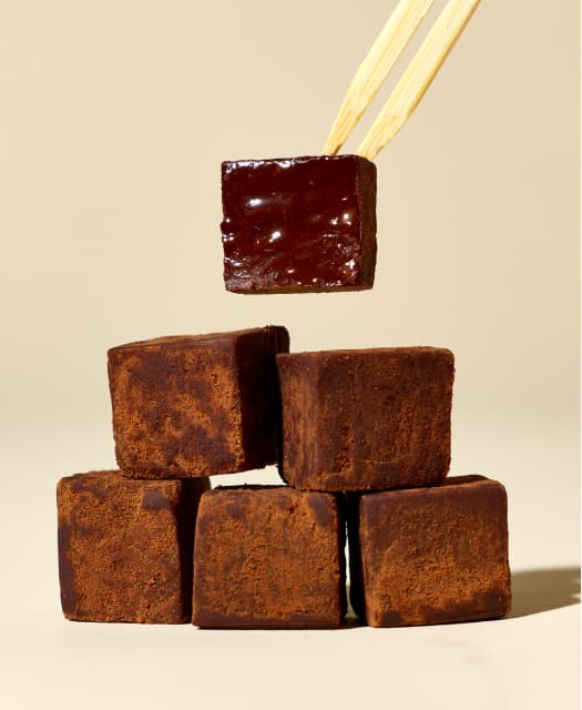 A stack of petite Kinu chocolate truffles