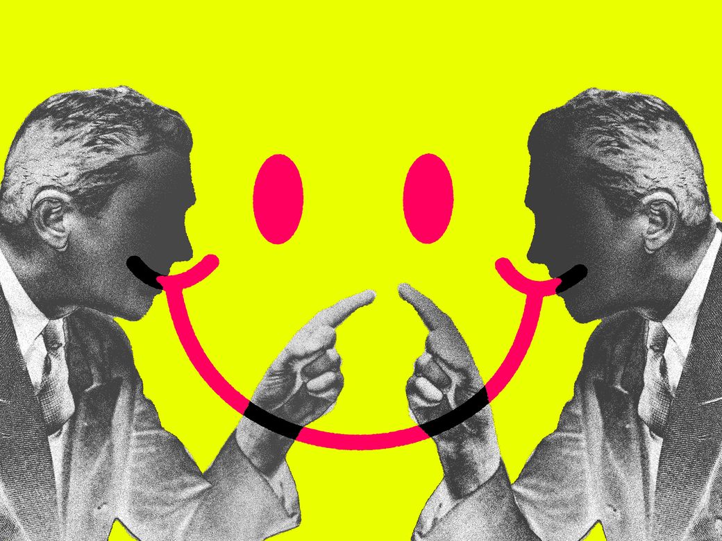 Two people point at each other, with a red happy face drawn over them.