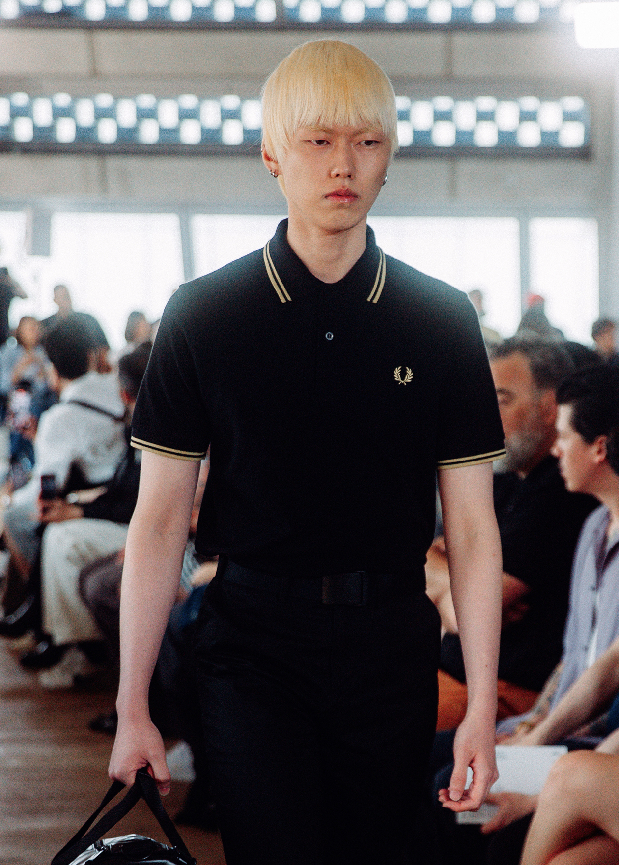 Male model wearing a Black / Champagne Fred Perry Shirt