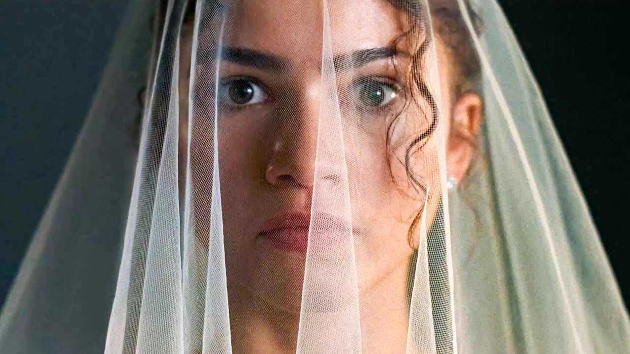 Close up of actor Zendaya in The Drama wearing a wedding veil.