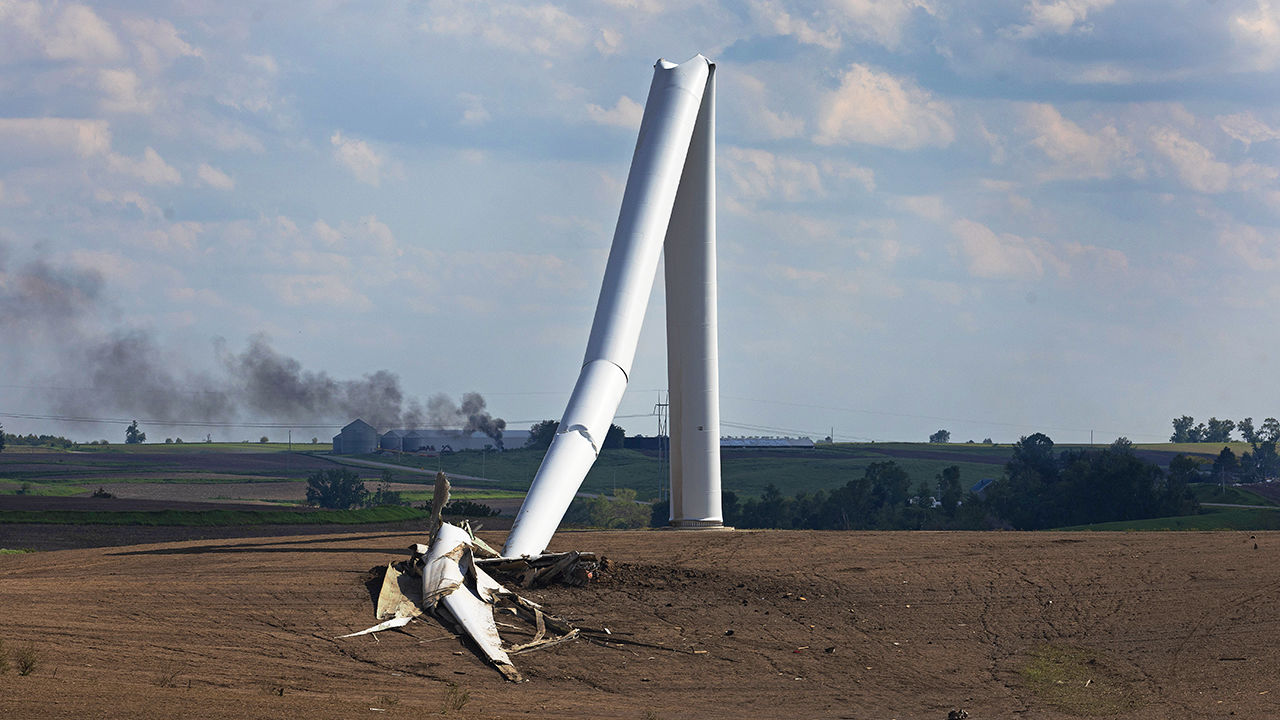 A destroyed wind turbine lies toppled in the aftermath of a tornado which ripped through the area in Iowa.