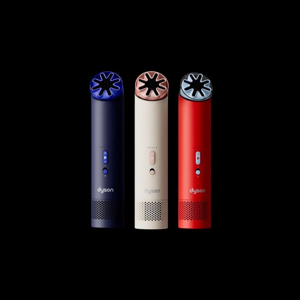 Three Dyson air purifiers in navy blue, beige, and red stand upright against a black background
