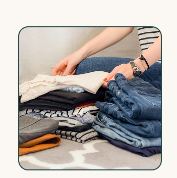 person folding clothes
