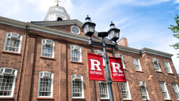 Rutgers banners are displayed in front of the administraiton building
