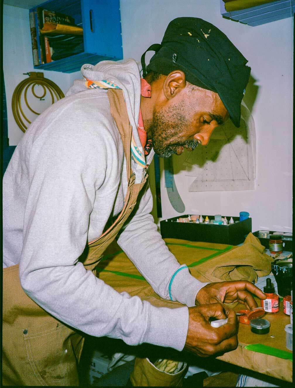 A person repairing a jacket.