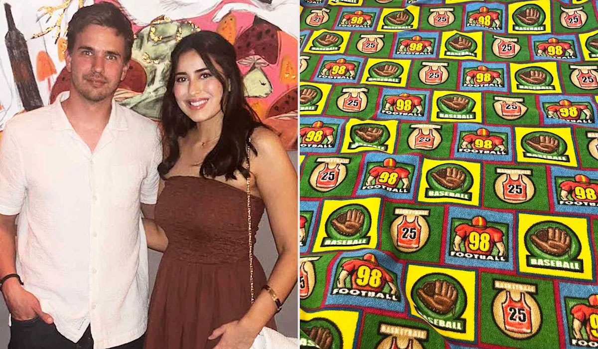 A man and woman pose next to a blanket.