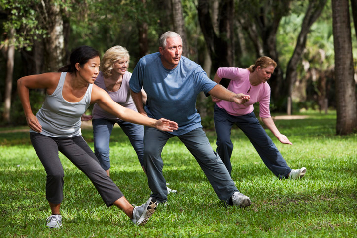 group 
performing tai chin in a park