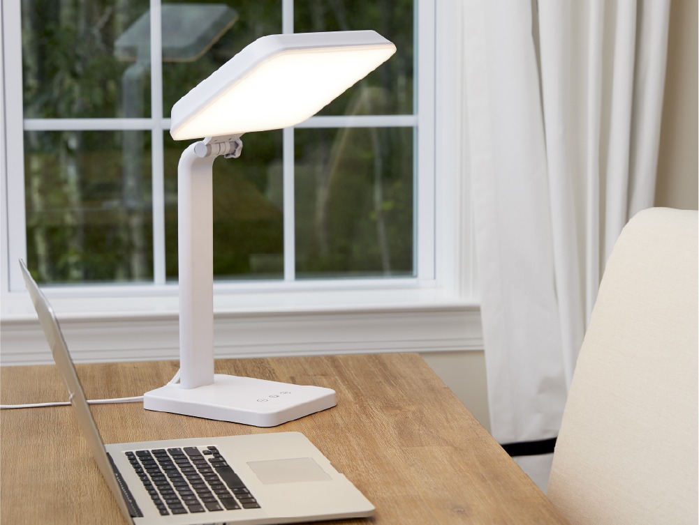 TheraLite Aura on a desk