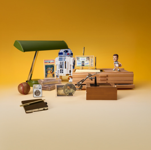 A display of various collectibles against a yellow background.