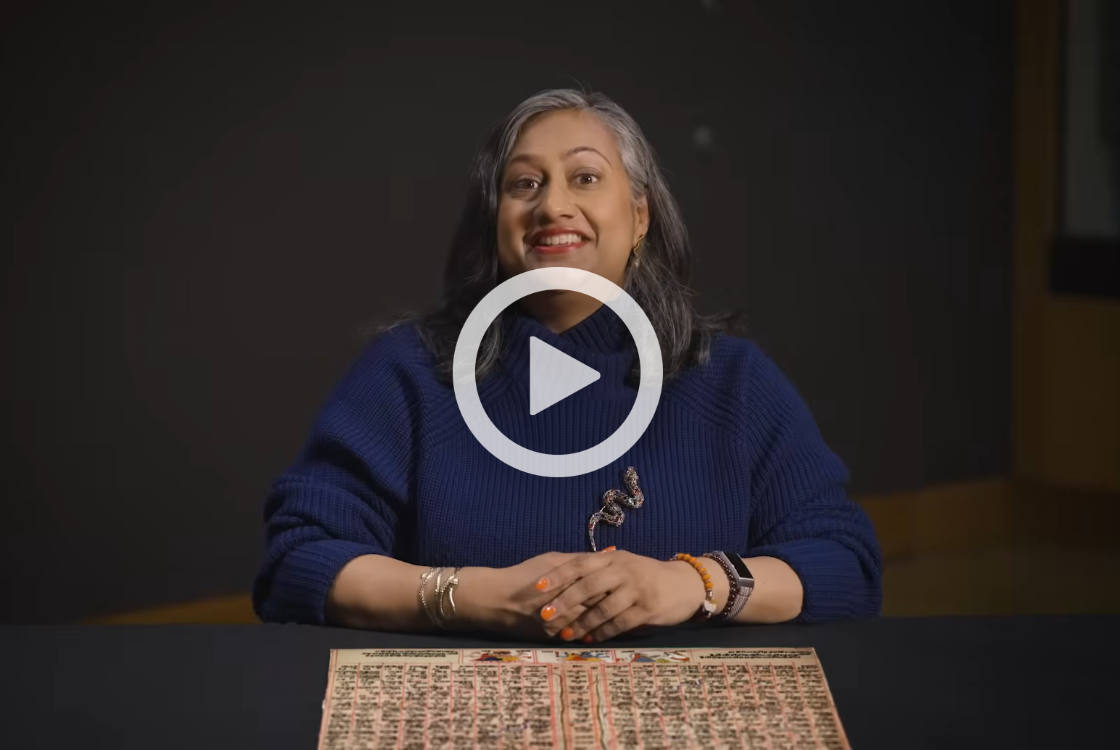 Play button over curator Sushima Jansari.