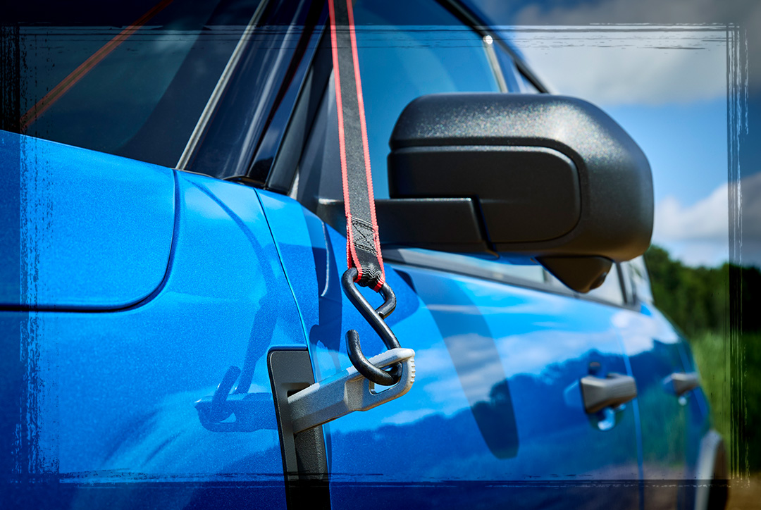 Side of a blue Ford Bronco Sport&reg; SUV with available fender tie‑downs shown