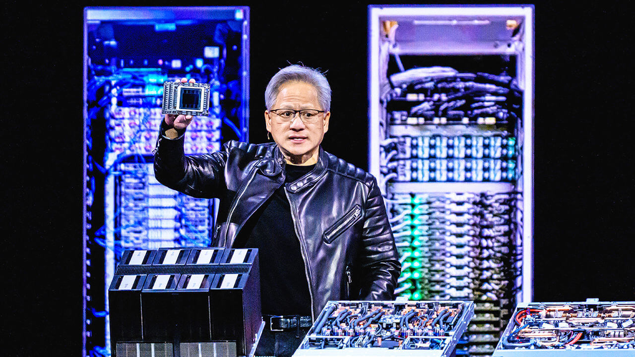 Nvidia CEO Jensen Huang holds up a chip with his right hand whilst he delivers the keynote address at the GTC AI Conference in San Jose, California, USA.