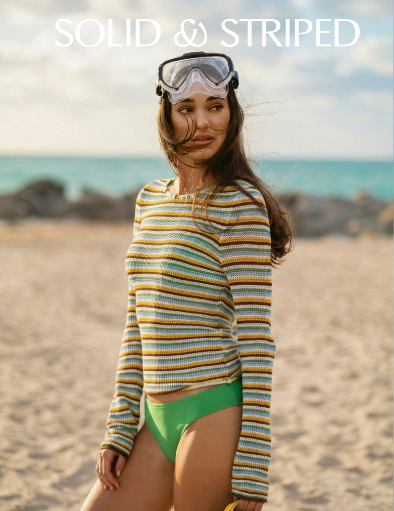 woman in a long sleeve stripe open knit top