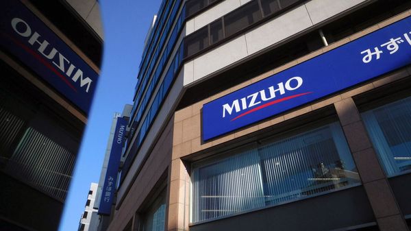 Signage for Mizuho Bank Ltd., a unit of Mizuho Financial Group Inc. (MHFG), at one of the bank's branches in Tokyo, Japan.