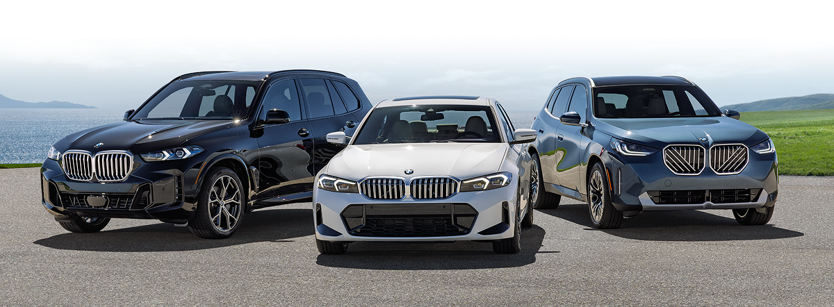 Three parked vehicles: a BMW X3, an X5, and a 3 Series