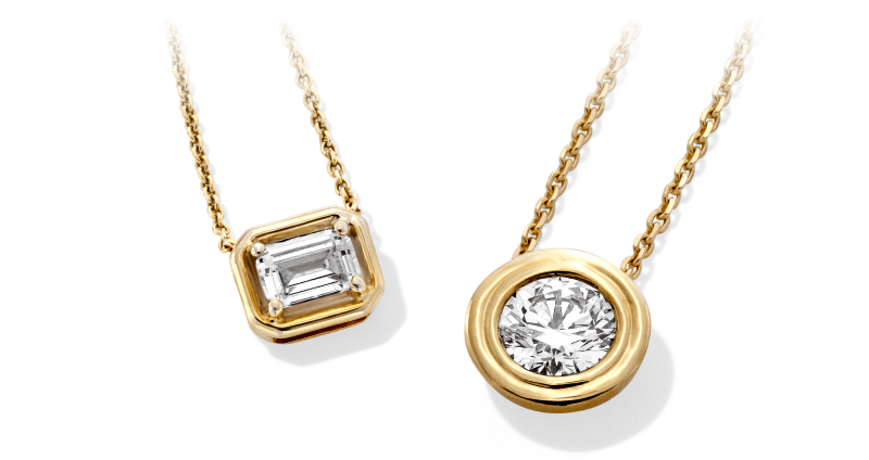 Gold necklaces with a baguette pendant and a round bezel-set diamond on delicate chains.