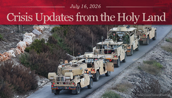 A line of Israeli military vehicles seen at a forest near the Israeli border with Lebanon.