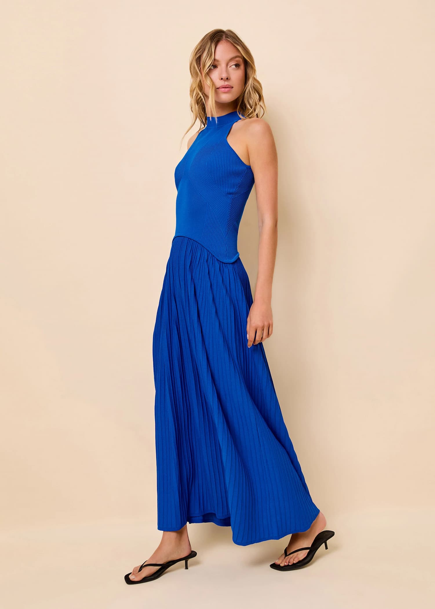 woman in ribbed bodice detailed dress in a royal blue