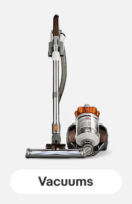 A Bissell Hard Floor Expert Canister Vacuum on a light gray tile.