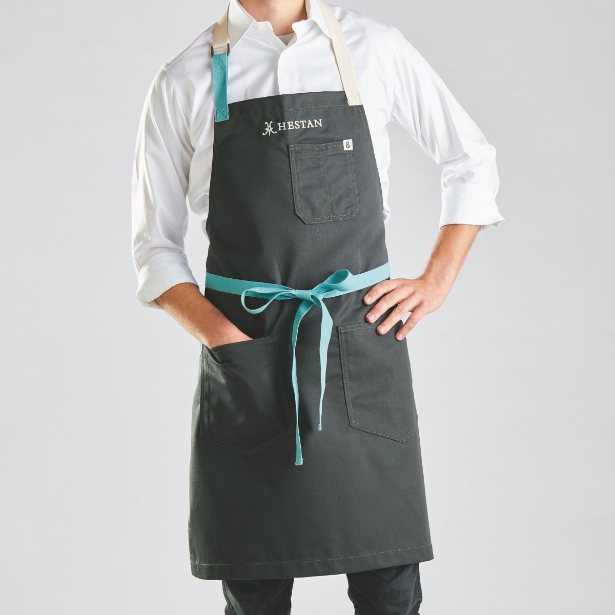 IMG: Male model wearing Hestan x Hedley & Bennett Chef's Apron, Bora Bora