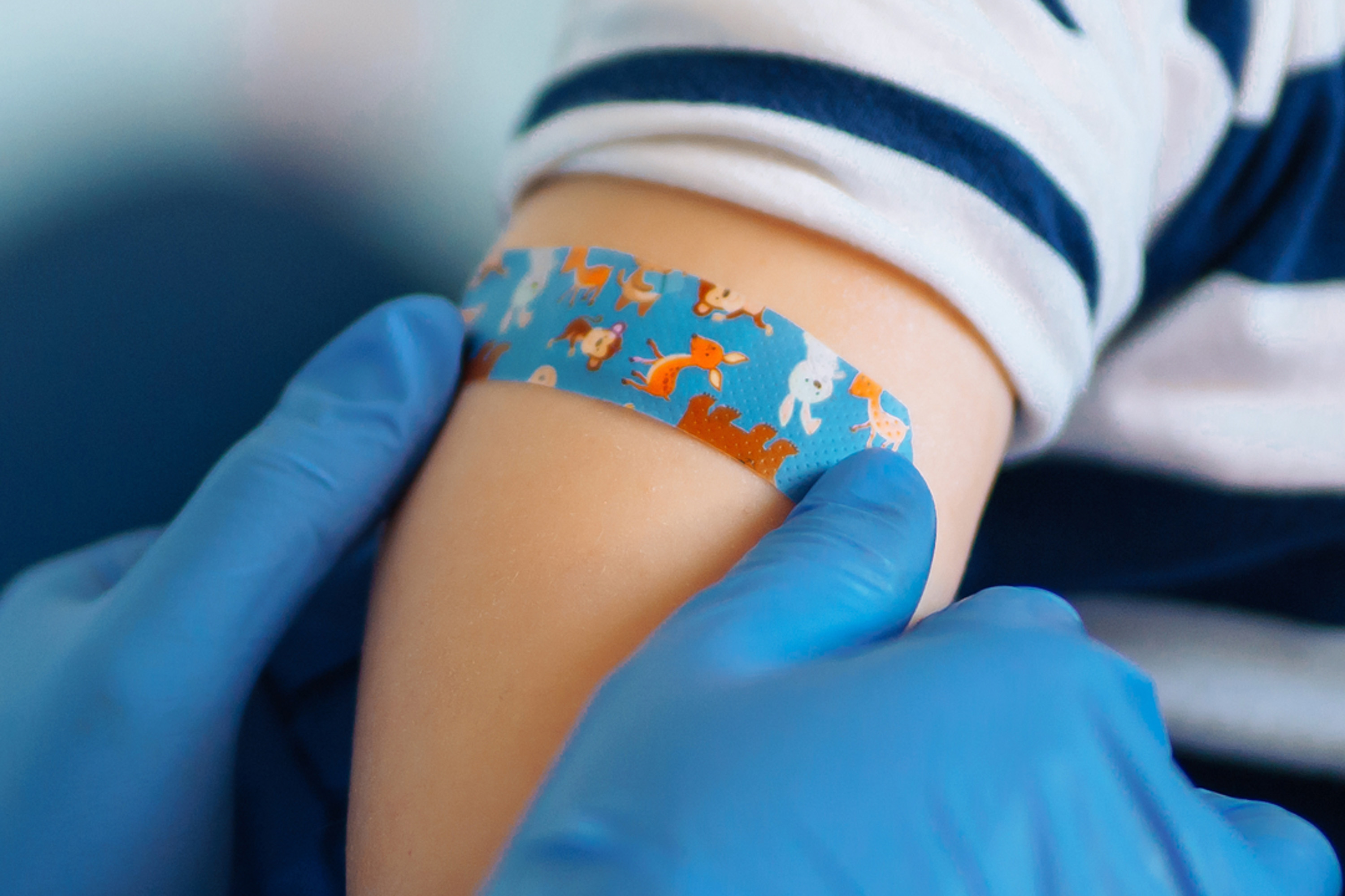 Band-aid on a child's arm.