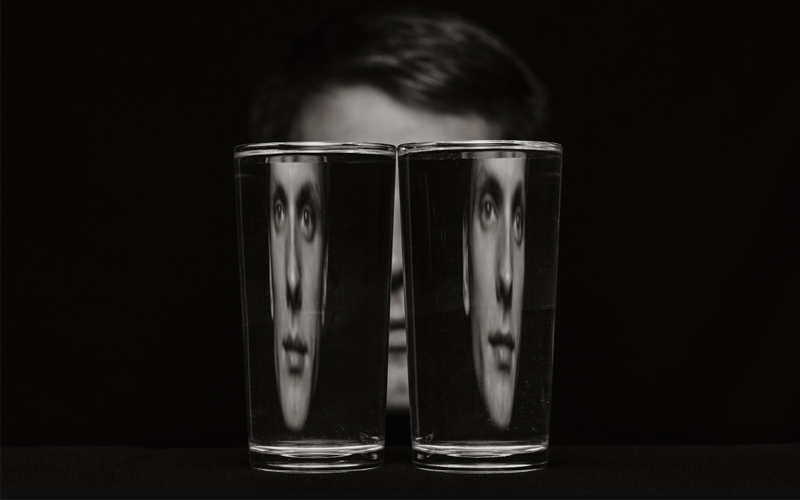 A person looking through a glass