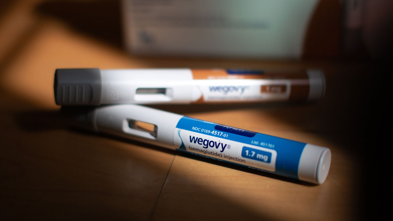 Wegovy injection pens on a desk in sunlight.