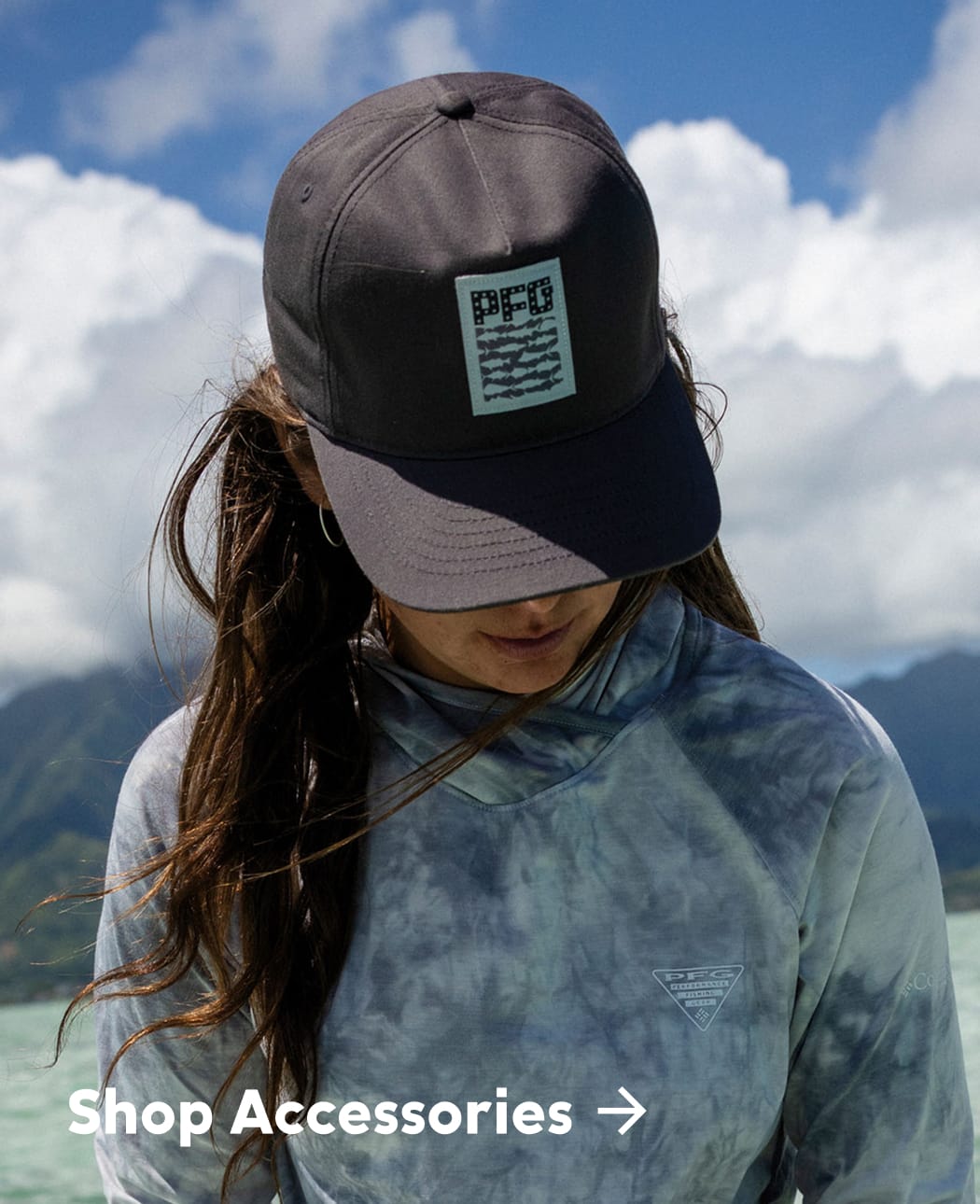 A close up of a woman wearing a PFG hat.