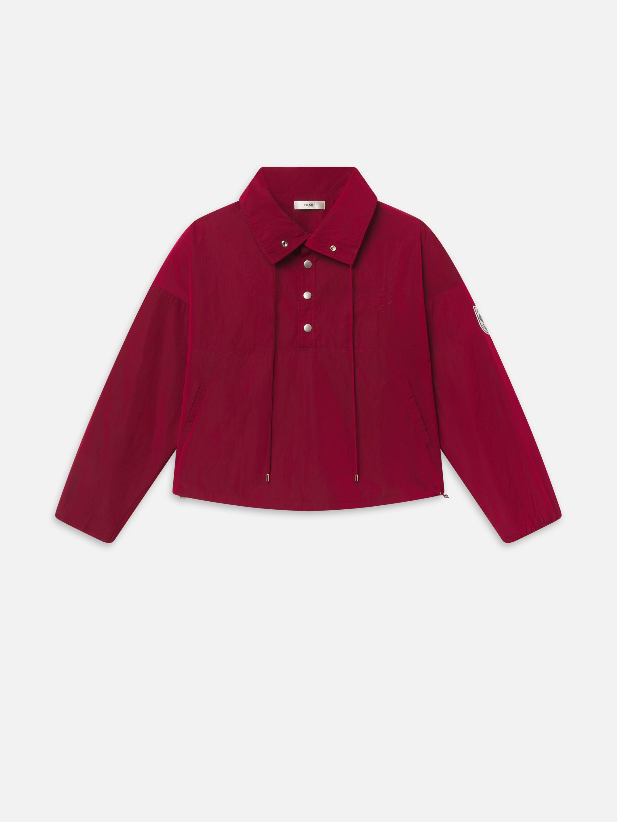 THE TENNIS WINDBREAKER IN ACE RED