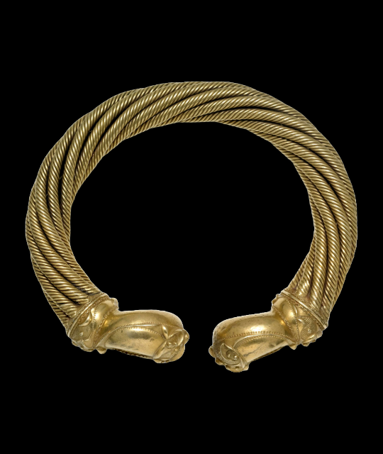 Golden bracelet with engraved design.