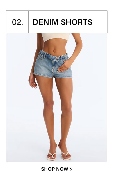 Women's light wash denim shorts with a unique criss-cross asymmetrical waistband. Perfect for summer style.