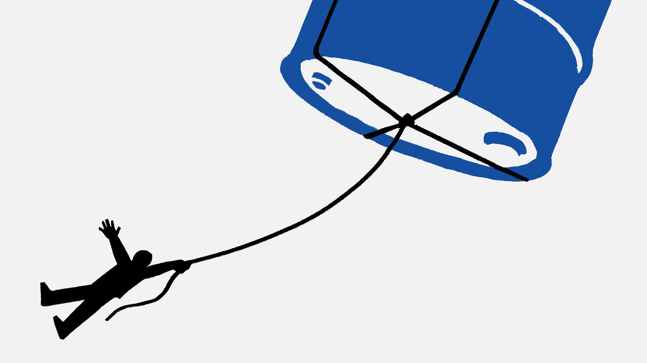 An oil barrel flying away with a person hanging at the end of a rope around it.