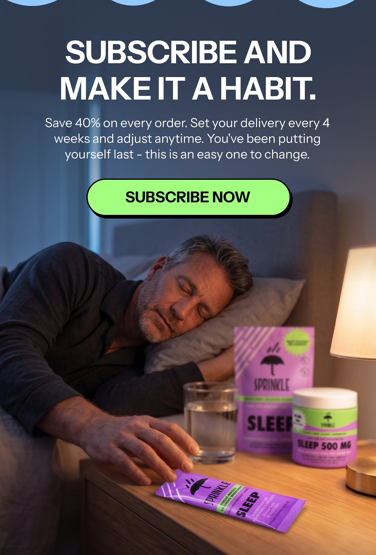 A man sleeping beside a nightstand with sleep products and a glass of water.