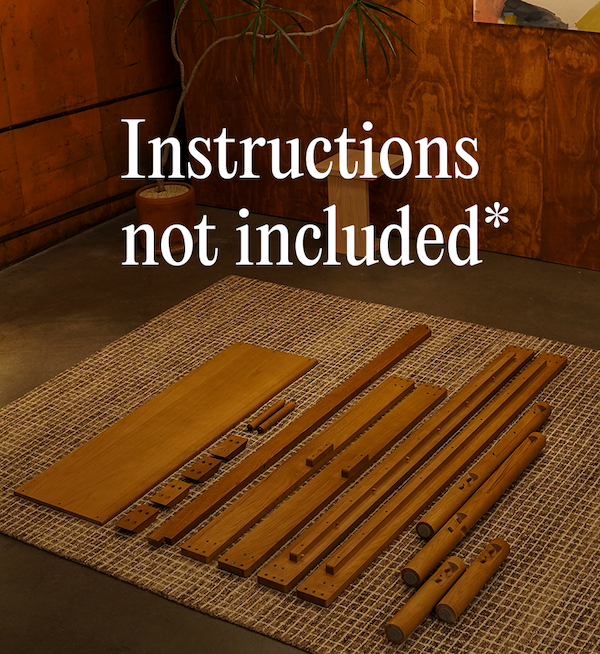 Keeps Home architect bed solid wood parts laying on carpet in room ready to be assembled. Instructions not included* in white