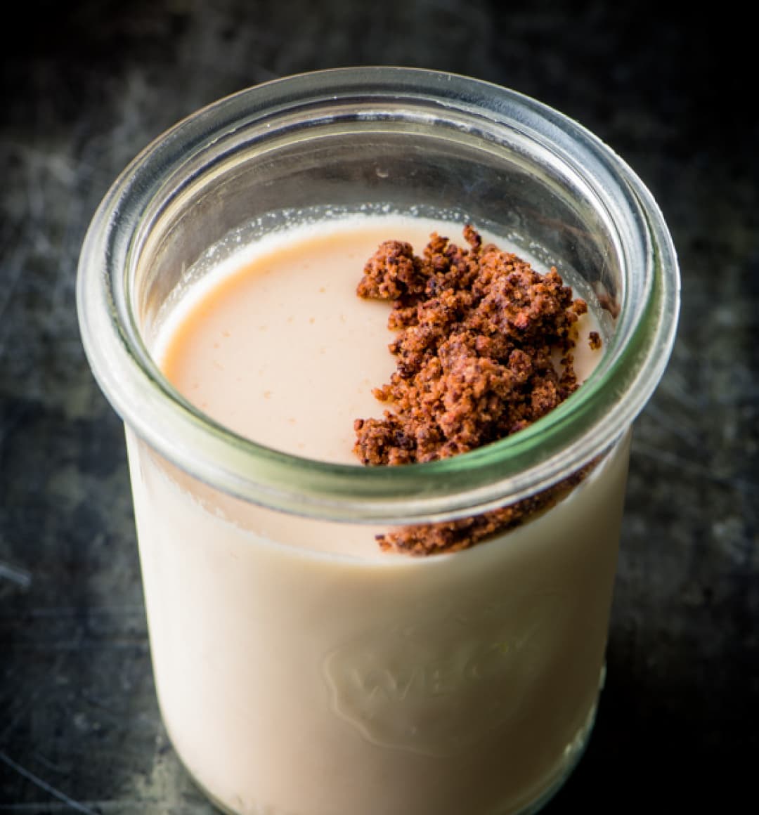 Lisa’s creamy Panna Cotta sits in a mason jar and is topped with cocoa nibs.