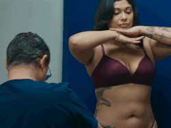 A GIF of a doctor photographing a person’s body.